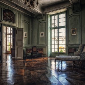 living room with brown wooden floor and white wooden door