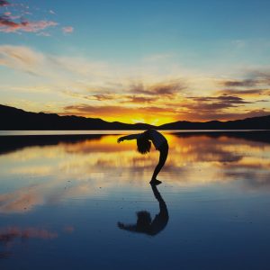 silhouette photography of woman doing yoga