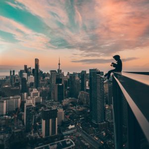 person sitting on top of the building