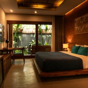 black and white bed near brown wooden table